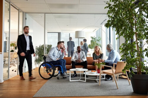 Diverse Executive Team Meeting in Office Reception Room