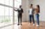 Estate Agent Showing Prospective Buyers Around Property