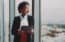 real estate agent looking out window
