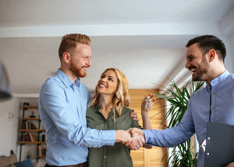 Young couple getting new house keys from a real estate sales agent, just one of many real estate careers available