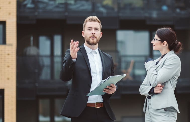 Real estate developer explaining the business to a young real estate agent