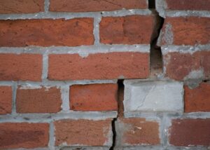 bricks showing broken foundation of house