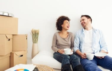 man and woman laughing in rental apartment