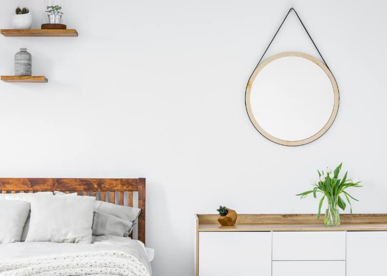 circle mirror in staged bedroom