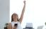 Young woman smiling victoriously after passing her real estate exam
