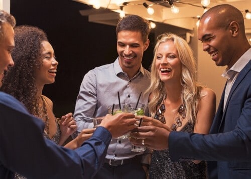 friends toasting at a networking event