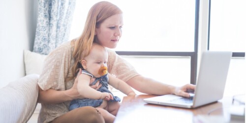 mom working on her real estate continuing education with baby