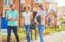 first-time homebuyers looks at housing with real estate agent