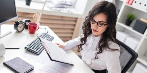 female real estate agent working at desk