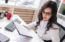 female real estate agent working at desk