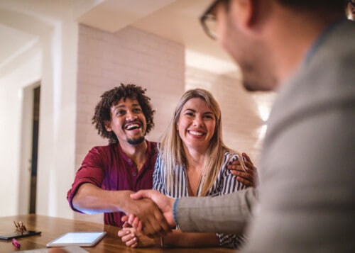 Real estate agent meeting with Millennial homebuyers