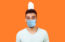 Real estate agent with face mask considering the affect of coronavirus on the real estate business