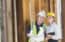 real estate agent talking to construction worker