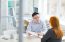 Portrait of young Asian businessman interviewing young woman for job position in modern office, copy space