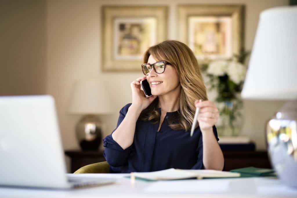 real estate agent talking to client on phone