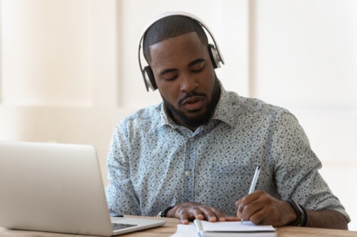 YOUNG MAN STUDYING REAL ESTATE