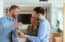 realtor handing keys to couple