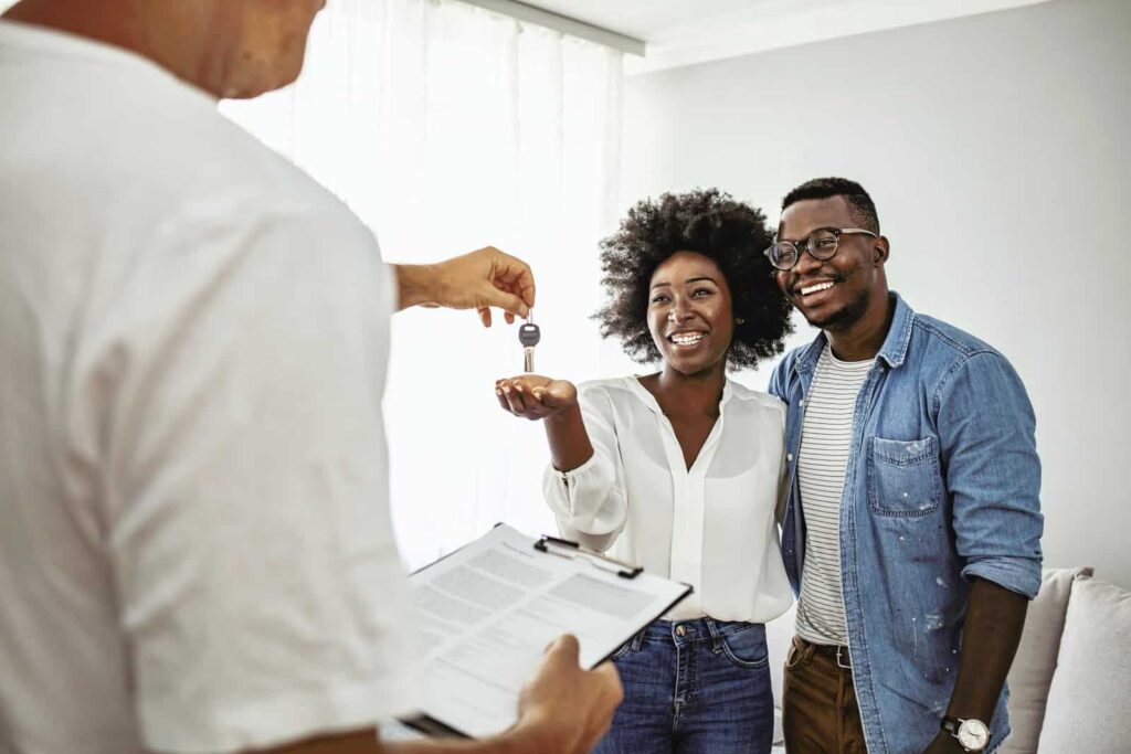 Georgia real estate agents showing a house to clients after getting their license