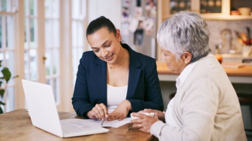 Real estate agent shows client listing agreement