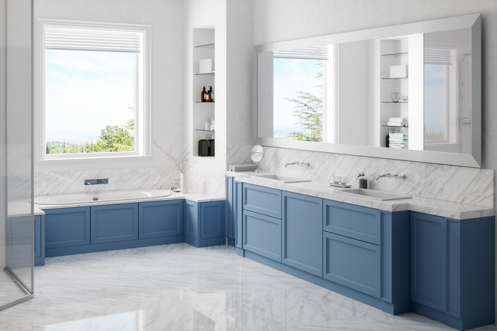 Interior of a contemporary white / blue bathroom with washstand and bathtube.