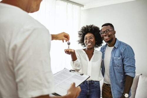 First-time homebuyers receive keys to new home