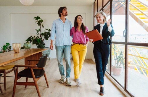 real estate agent in California shows home to couple