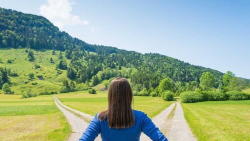 a woman stands in front of a path – how to choose a career based on personality