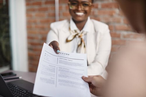 woman submits resume after returning to work after a career break