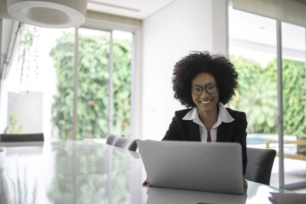 Portrait of real estate agent in front of laptop